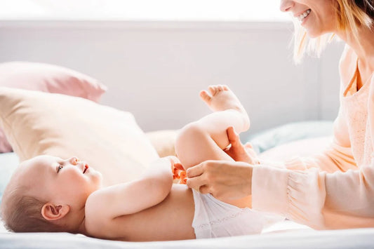 Mum changes baby's nappy