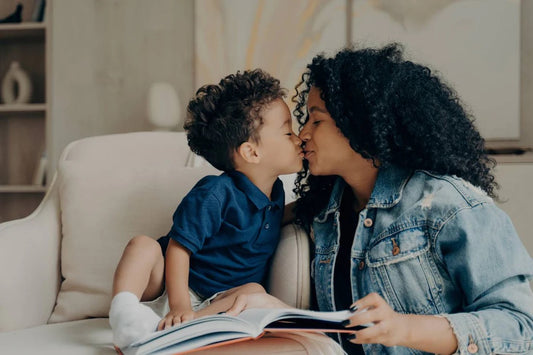 Mum kisses toddler son