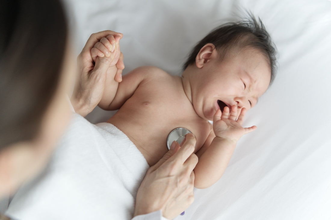 Baby with whooping cough at doctor