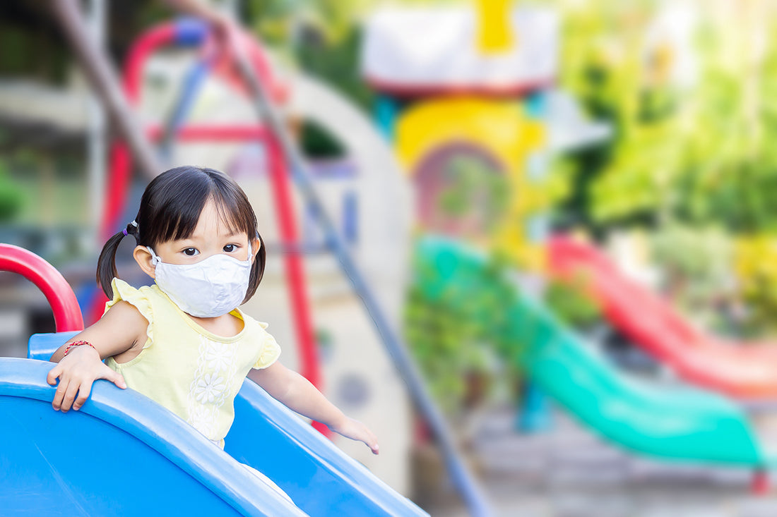 child-with-mask-in-playground