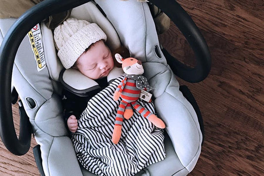 baby sleeping in car seat at night