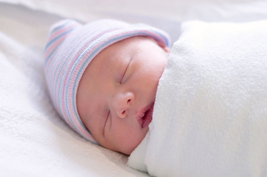 new-baby-swaddled-in-hospital-first-day-of-life