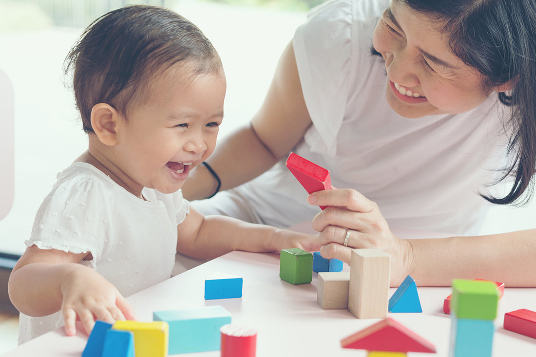 confident-toddler-playing-with-mum