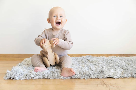 Baby playing with a safe toy