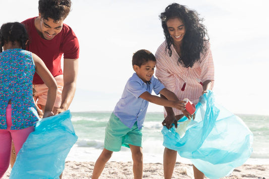 acts of kindness: family picking up beach