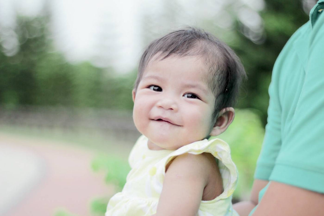 A baby girl smiles