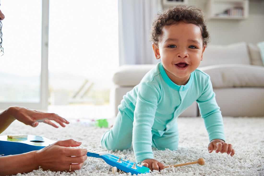 Baby boy smiling and crawling