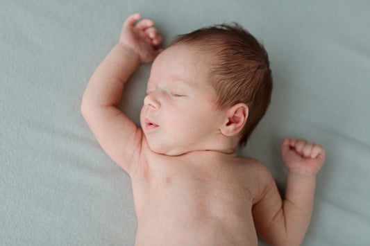 Infant sleeping safely on back