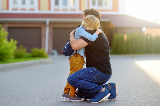 how to connect after a tantrum - child and father hugging outside