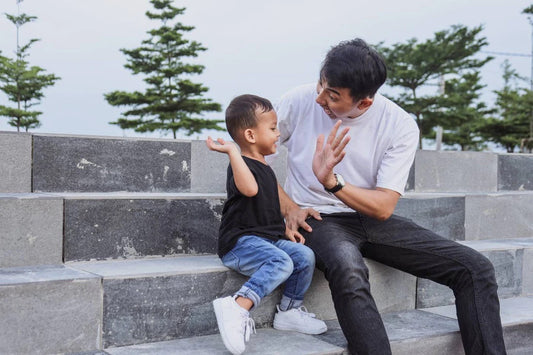 Toddler and father high-five