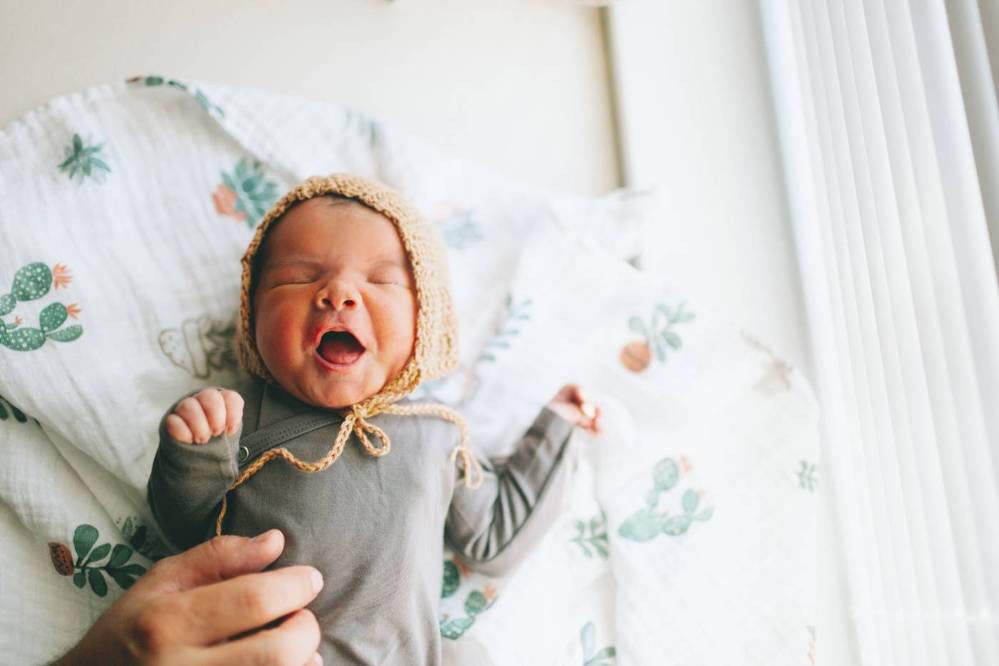 New born baby wearing winter hat