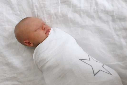 A baby sleeping safely