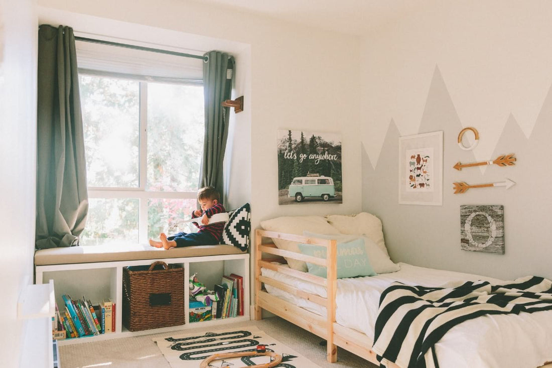 Toddler bedroom with twin bed and mountain mural.