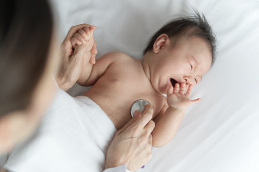 Baby with whooping cough at doctor